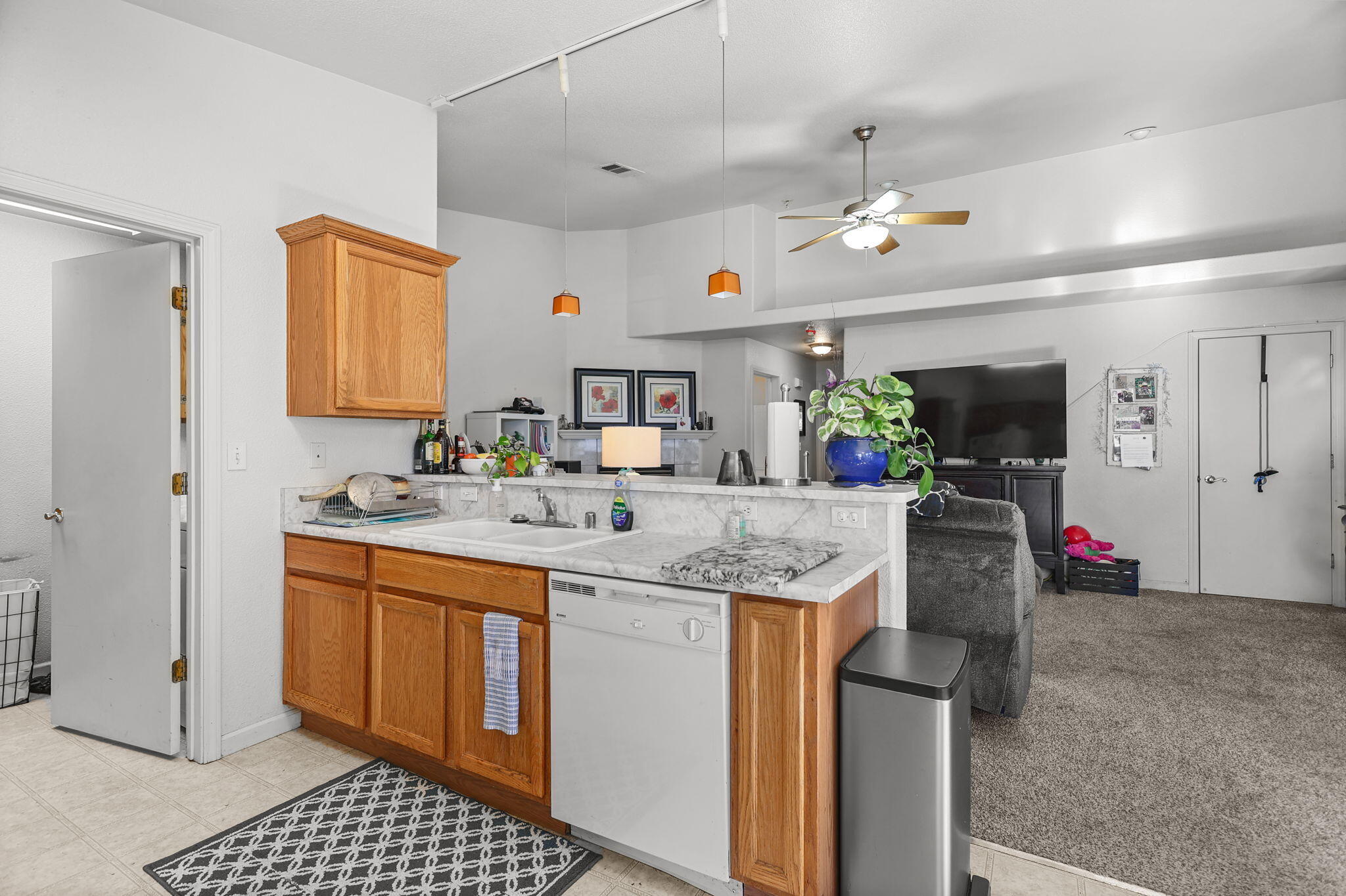 720 Stonebriar Trail Redding, CA 96003 - Photo 8 of 19 a kitchen with stainless steel appliances granite countertop a sink and a refrigerator