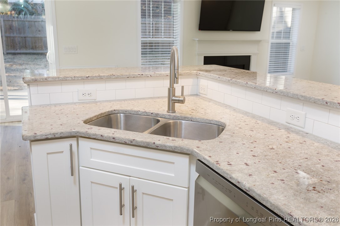 600 Burning Tree Road Pinehurst, NC 28374 - Photo 14 of 31 a kitchen with a sink and cabinets