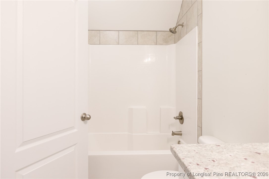 600 Burning Tree Road Pinehurst, NC 28374 - Photo 26 of 31 a bathroom with a bathtub and a shower