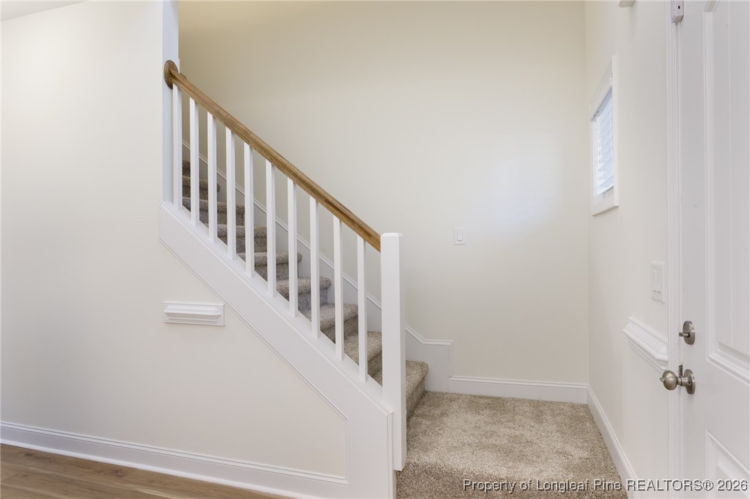 600 Burning Tree Road Pinehurst, NC 28374 - Photo 4 of 31 a view of a hallway with staircase