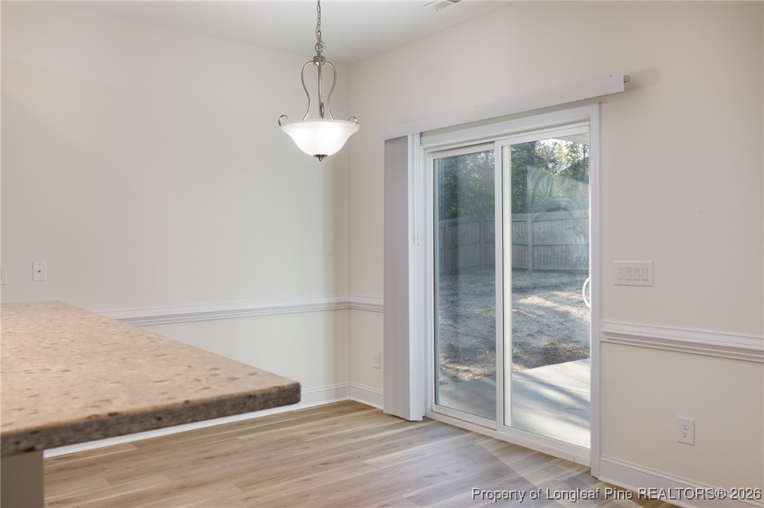 600 Burning Tree Road Pinehurst, NC 28374 - Photo 10 of 31 a view of a room with wooden floor and windows