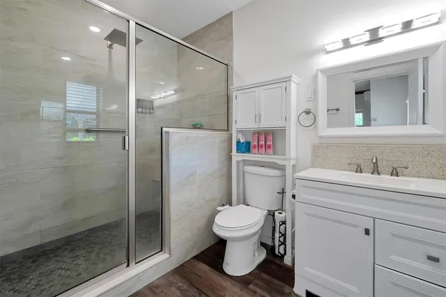 a view of a utility room with wooden floor