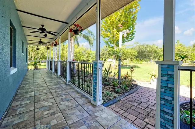 a view of livingroom with hardwood floor and a ceiling fan
