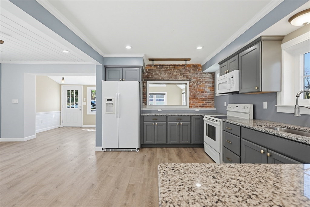44 Clark Street Spencer, MA 01562 - Photo 13 of 41 a kitchen with a cabinets and a stove top oven