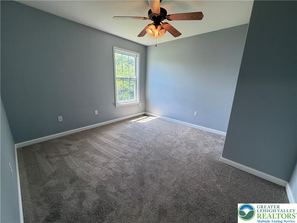4157 Walter Road Bethlehem, PA 18020 - Photo 23 of 36 A well-lit bedroom featuring a ceiling fan and plush carpeting.