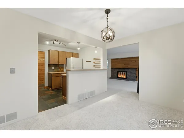 a view of a kitchen and a microwave