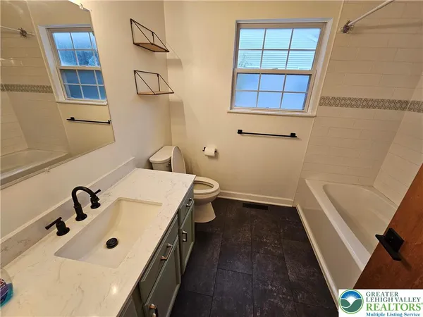 a bathroom with a sink and a bathtub