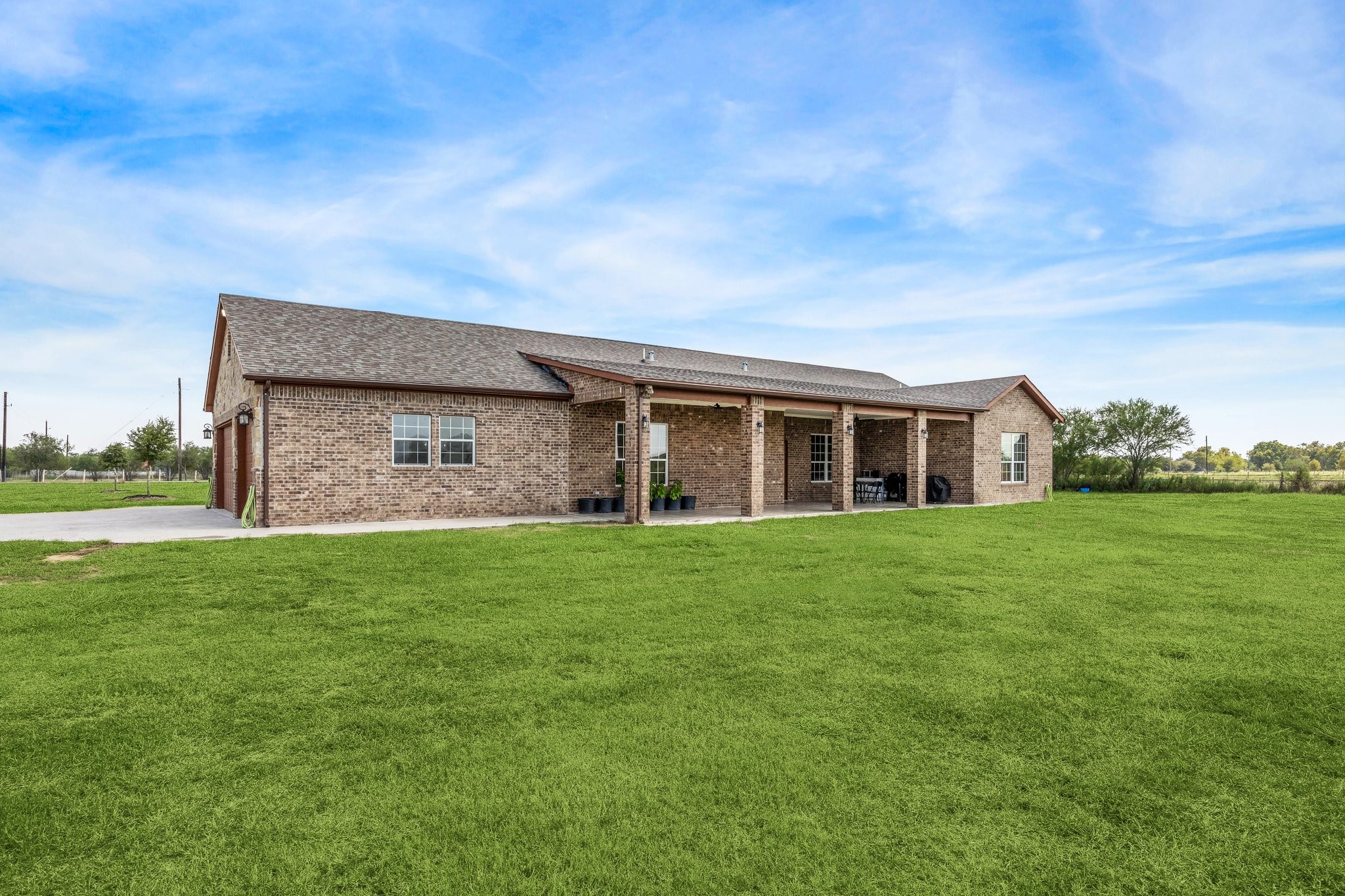 2787 Maler Road Sealy, TX 77474 - Photo 14 of 17 a brick house with a big yard
