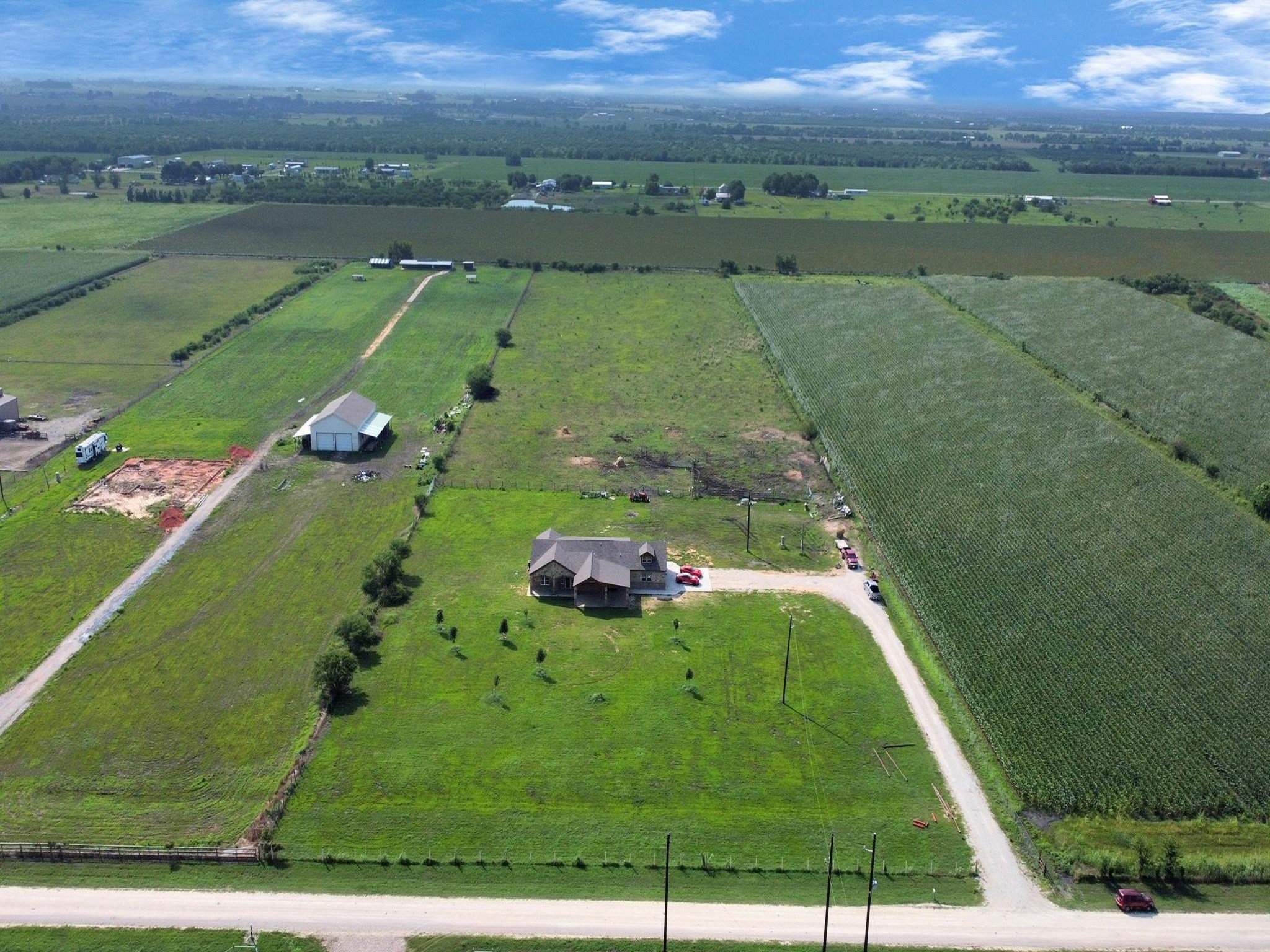 2787 Maler Road Sealy, TX 77474 - Photo 15 of 17 a view of a golf course with a lake