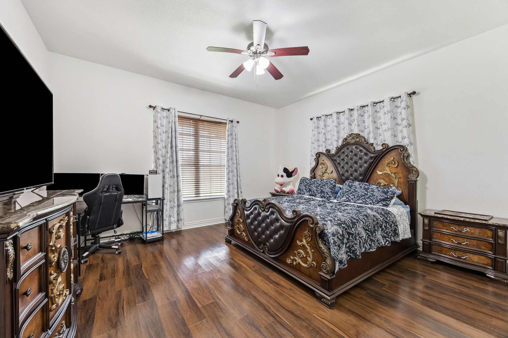 2787 Maler Road Sealy, TX 77474 - Photo 5 of 17 a bedroom with a bed and a flat screen tv