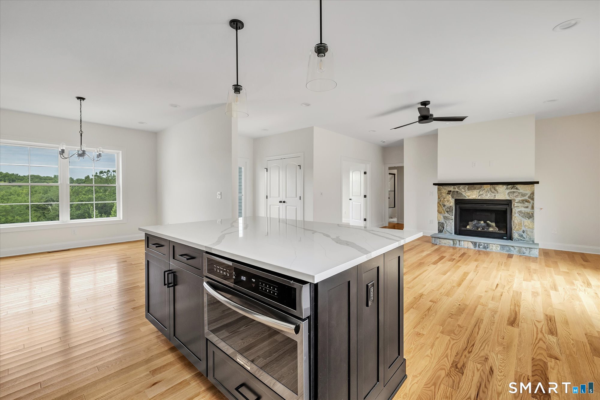 20 Hunting Ridge Road Middlebury, CT 06762 - Photo 11 of 29 a kitchen with a stove and a wooden floor