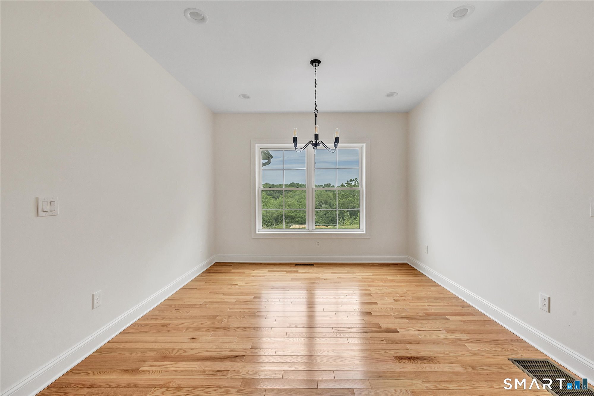 20 Hunting Ridge Road Middlebury, CT 06762 - Photo 15 of 29 a view of an empty room with wooden floor and a window
