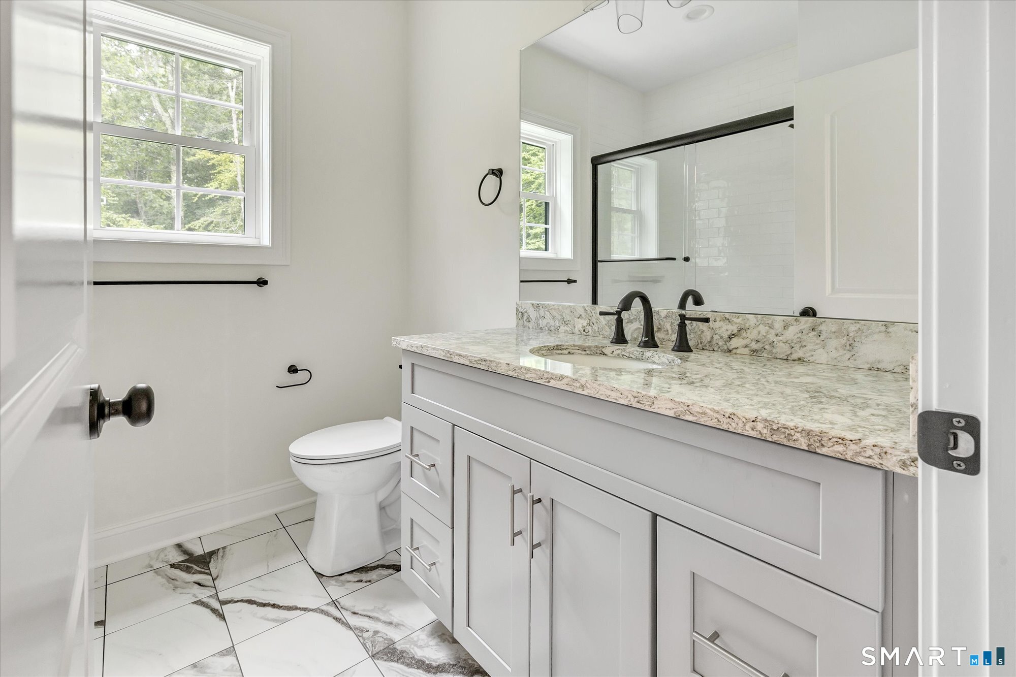 20 Hunting Ridge Road Middlebury, CT 06762 - Photo 21 of 29 a bathroom with a granite countertop toilet sink and mirror
