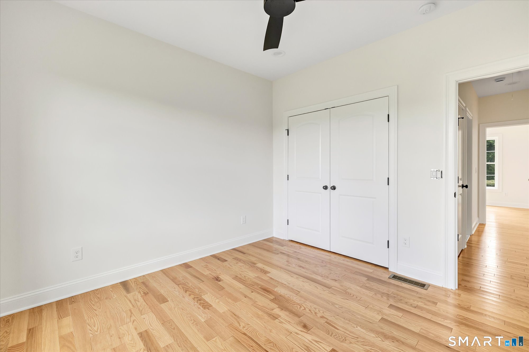 20 Hunting Ridge Road Middlebury, CT 06762 - Photo 26 of 29 a view of empty room with wooden floor