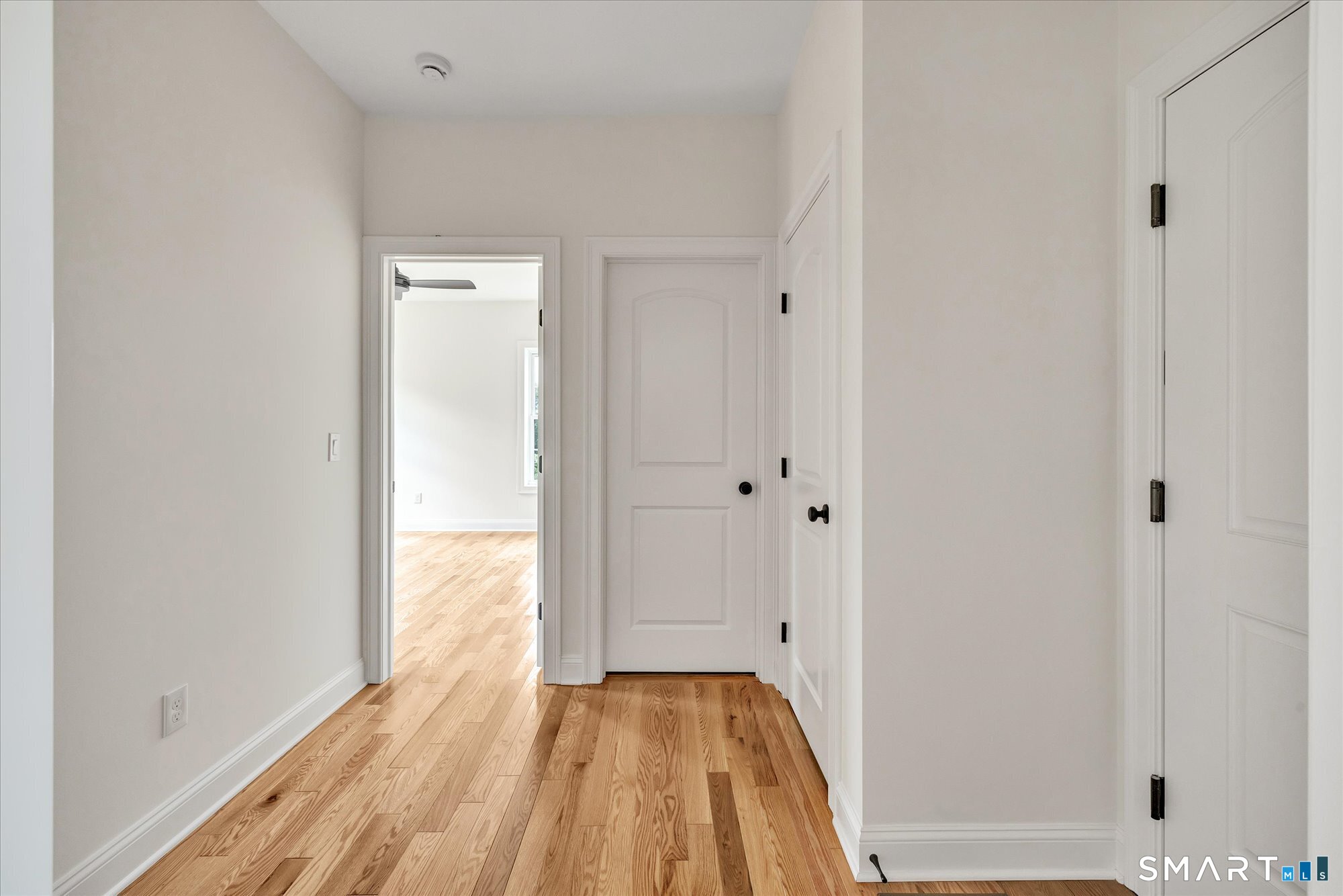 20 Hunting Ridge Road Middlebury, CT 06762 - Photo 27 of 29 a view of a room with wooden floor and a bathroom