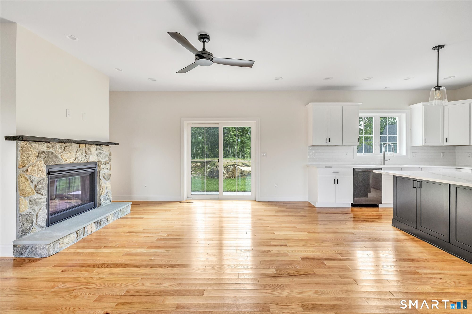 20 Hunting Ridge Road Middlebury, CT 06762 - Photo 3 of 29 a view of a kitchen with a sink a microwave and cabinets