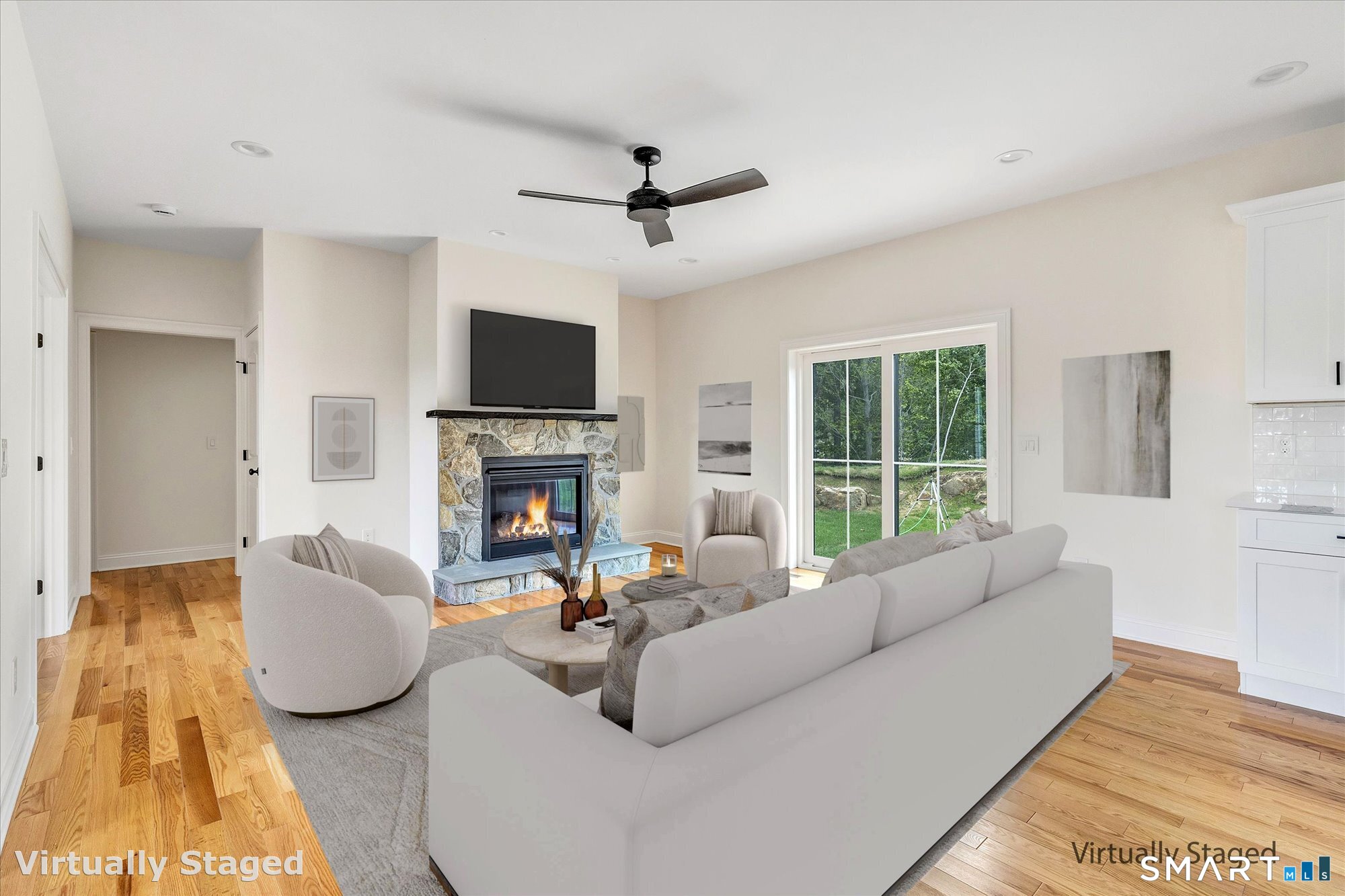 20 Hunting Ridge Road Middlebury, CT 06762 - Photo 5 of 29 a living room with furniture a fireplace and a flat screen tv