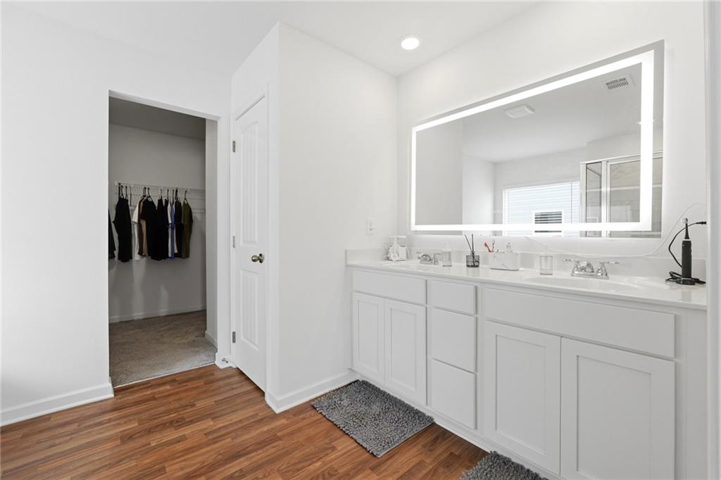760 Oakmont Trace Canton, GA 30114 - Photo 13 of 25 a bathroom with a sink and a mirror