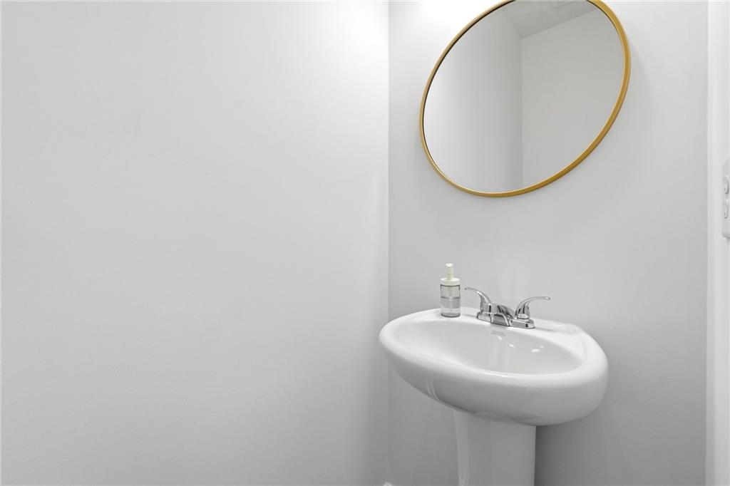760 Oakmont Trace Canton, GA 30114 - Photo 18 of 25 a bathroom with a sink and a mirror