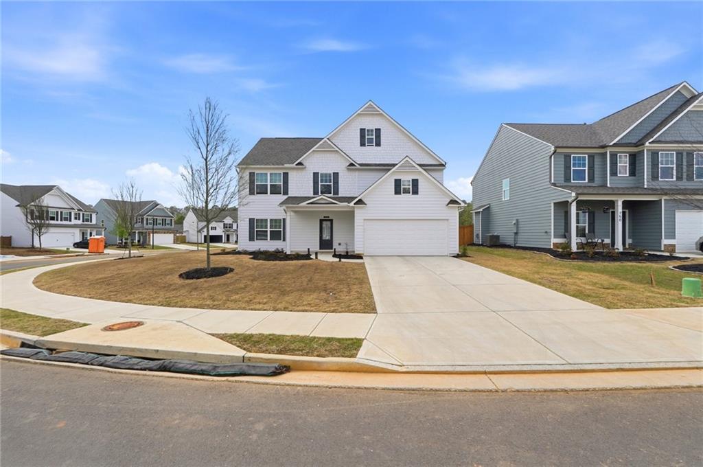 760 Oakmont Trace Canton, GA 30114 - Photo 2 of 25 a view of multiple houses with a street
