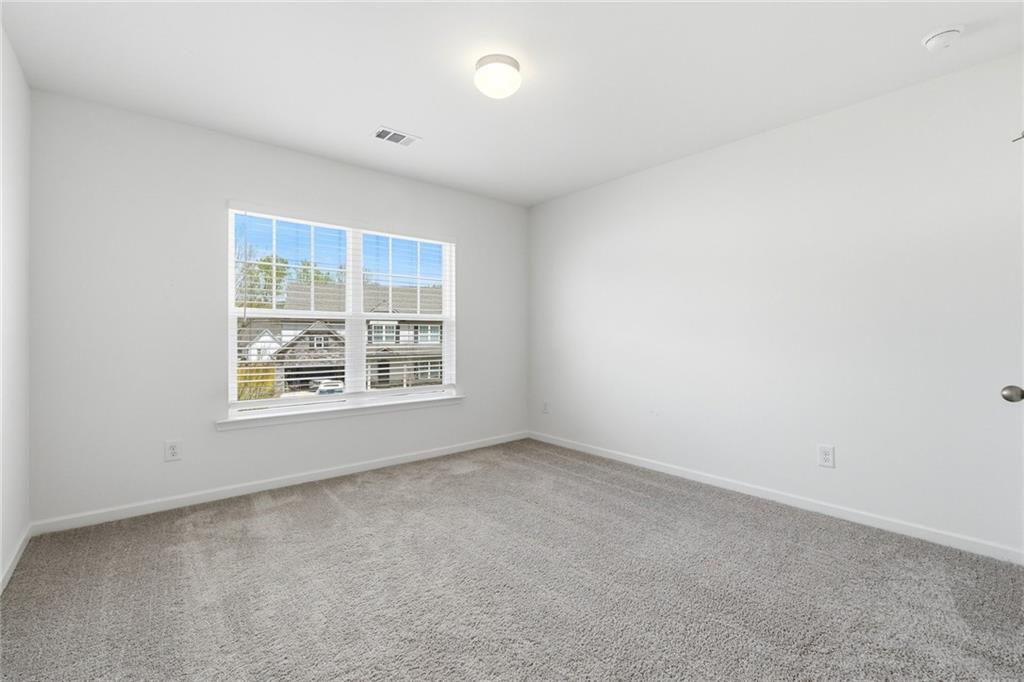 760 Oakmont Trace Canton, GA 30114 - Photo 22 of 25 an empty room with a window