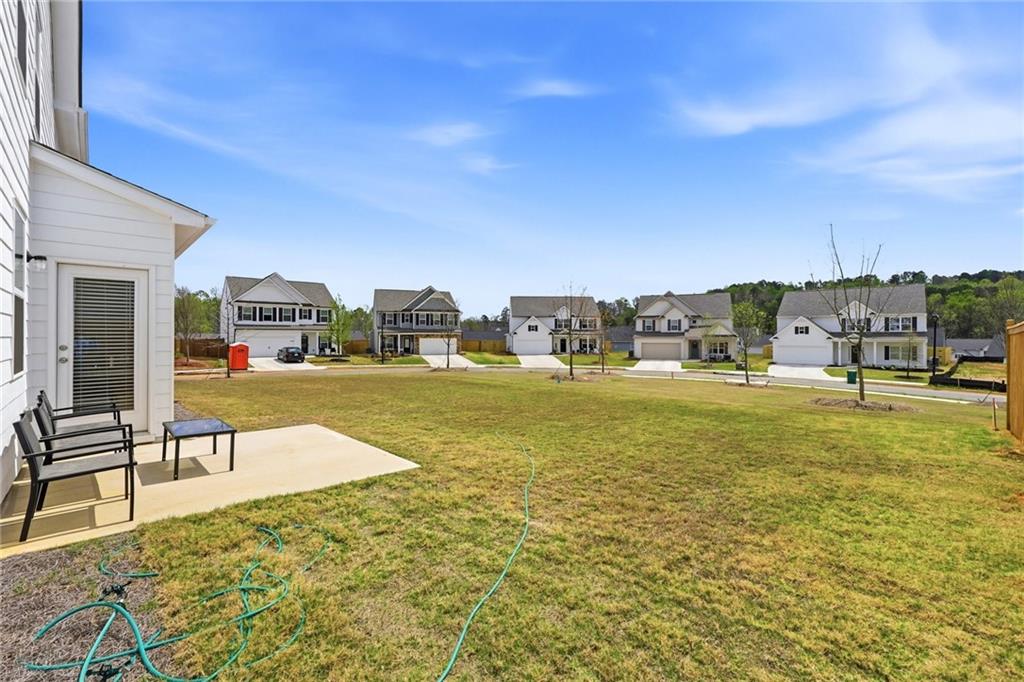 760 Oakmont Trace Canton, GA 30114 - Photo 24 of 25 a view of swimming pool with lawn chairs and iron fence