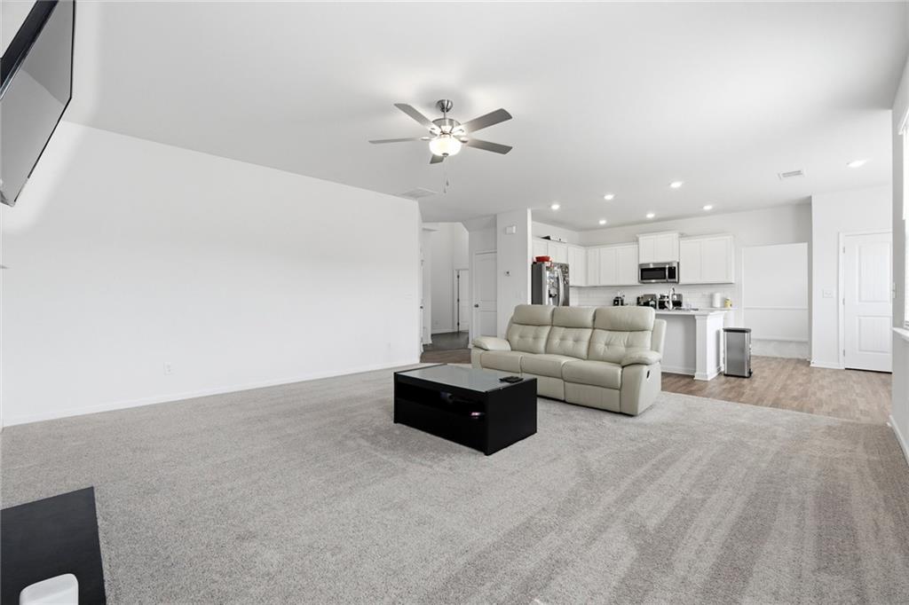 760 Oakmont Trace Canton, GA 30114 - Photo 7 of 25 a living room with furniture and kitchen view