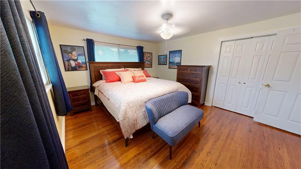 362 Mercer Road Harmony, PA 16037 - Photo 15 of 34 a bedroom with a bed and wooden floor