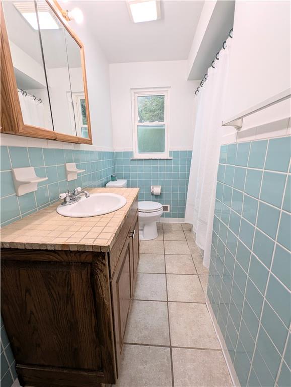 362 Mercer Road Harmony, PA 16037 - Photo 18 of 34 a bathroom with a sink a toilet and a mirror