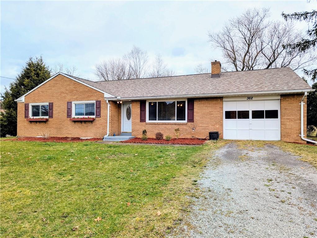 362 Mercer Road Harmony, PA 16037 - Photo 2 of 34 a front view of a house with a garden and yard