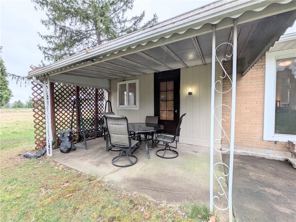362 Mercer Road Harmony, PA 16037 - Photo 29 of 34 a view of backyard with wooden fence and a slide