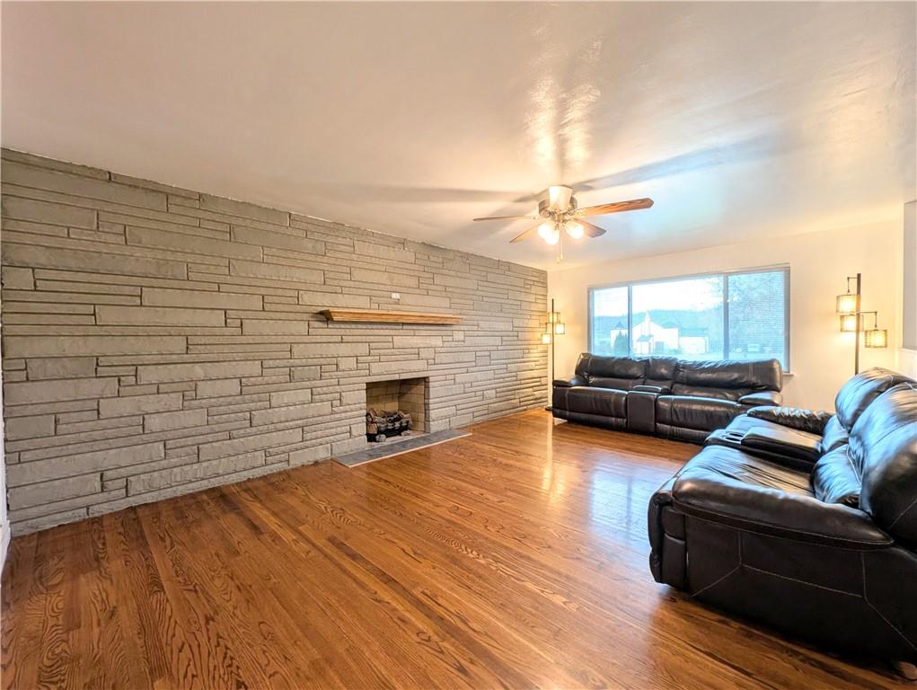 362 Mercer Road Harmony, PA 16037 - Photo 5 of 34 a living room with furniture floor to ceiling window and a fireplace
