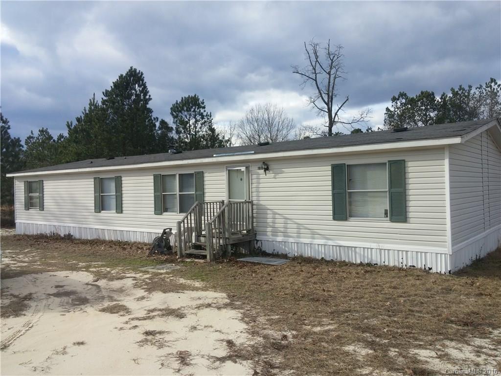 1818 State Rd S-28-55 Lugoff, SC 29078 - Photo 1 of 12 a backyard of a house