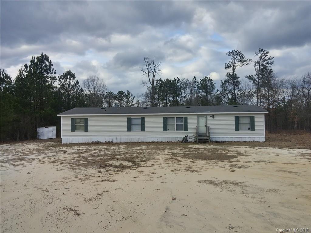 1818 State Rd S-28-55 Lugoff, SC 29078 - Photo 2 of 12 a backyard of a house