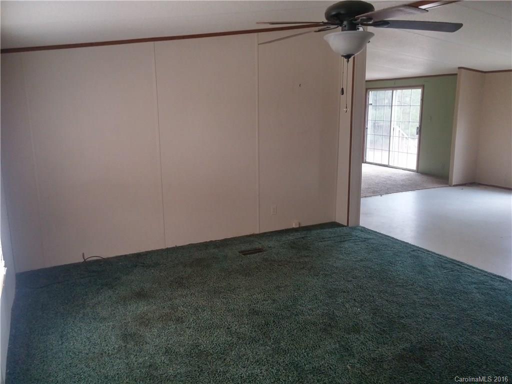 1818 State Rd S-28-55 Lugoff, SC 29078 - Photo 4 of 12 a view of an empty room and a window