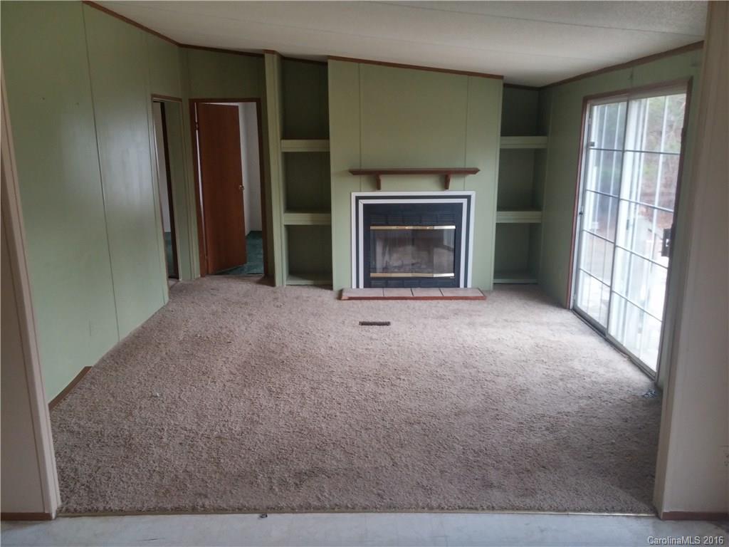 1818 State Rd S-28-55 Lugoff, SC 29078 - Photo 6 of 12 a view of empty room with a fireplace
