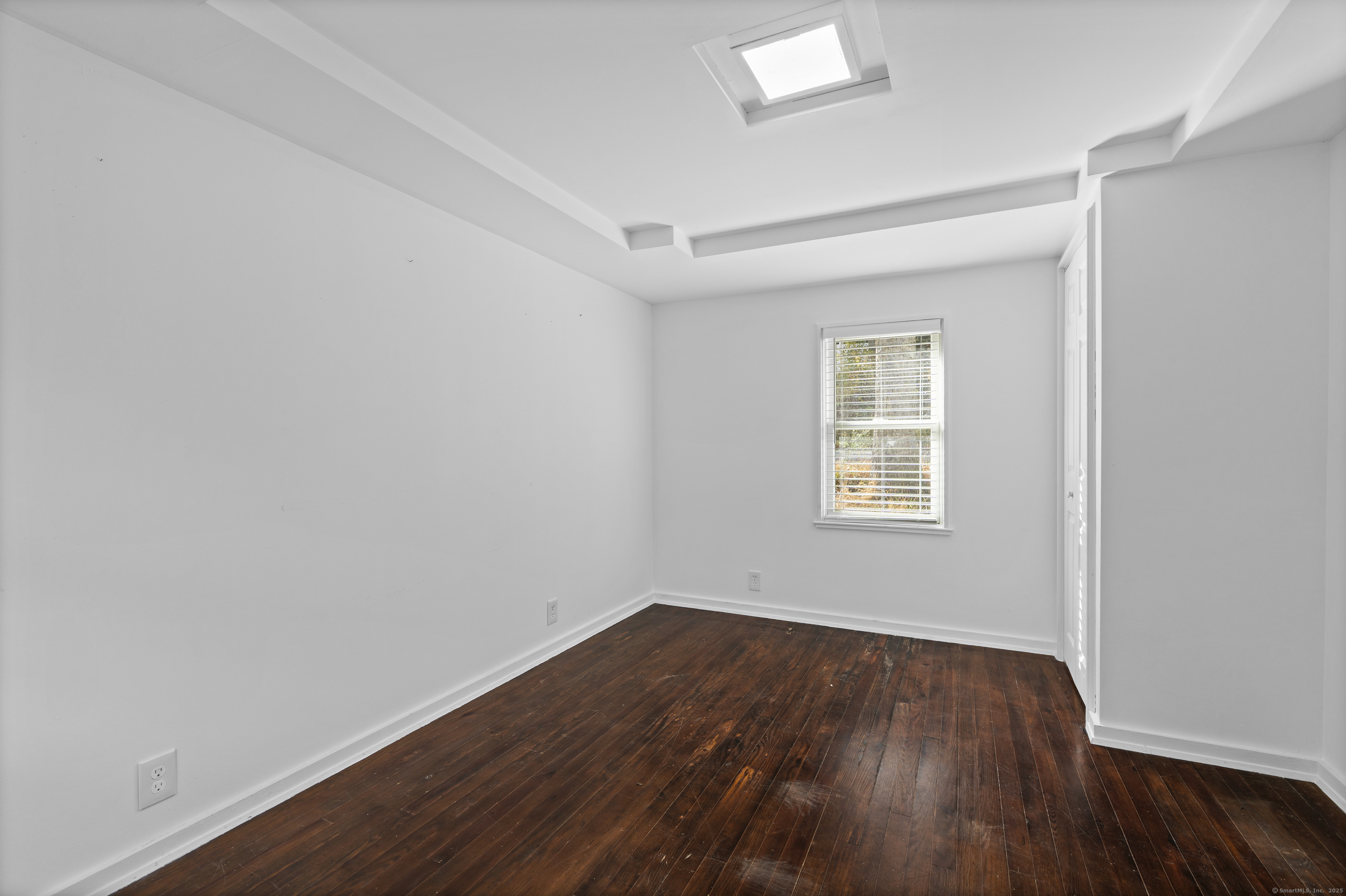 612 Kent Road New Milford, CT 06755 - Photo 11 of 35 an empty room with wooden floor and windows