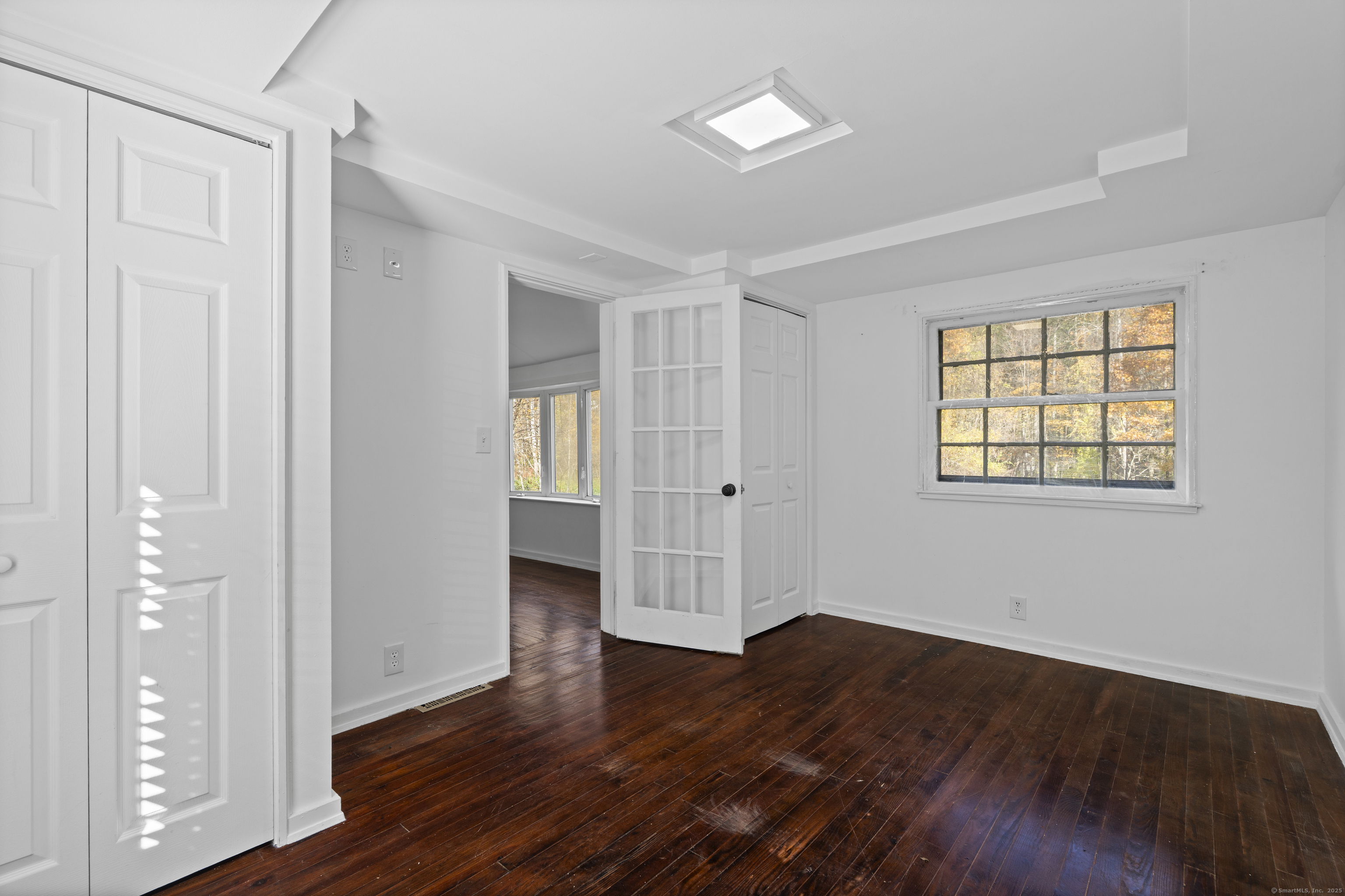 612 Kent Road New Milford, CT 06755 - Photo 12 of 35 an empty room with wooden floor and windows