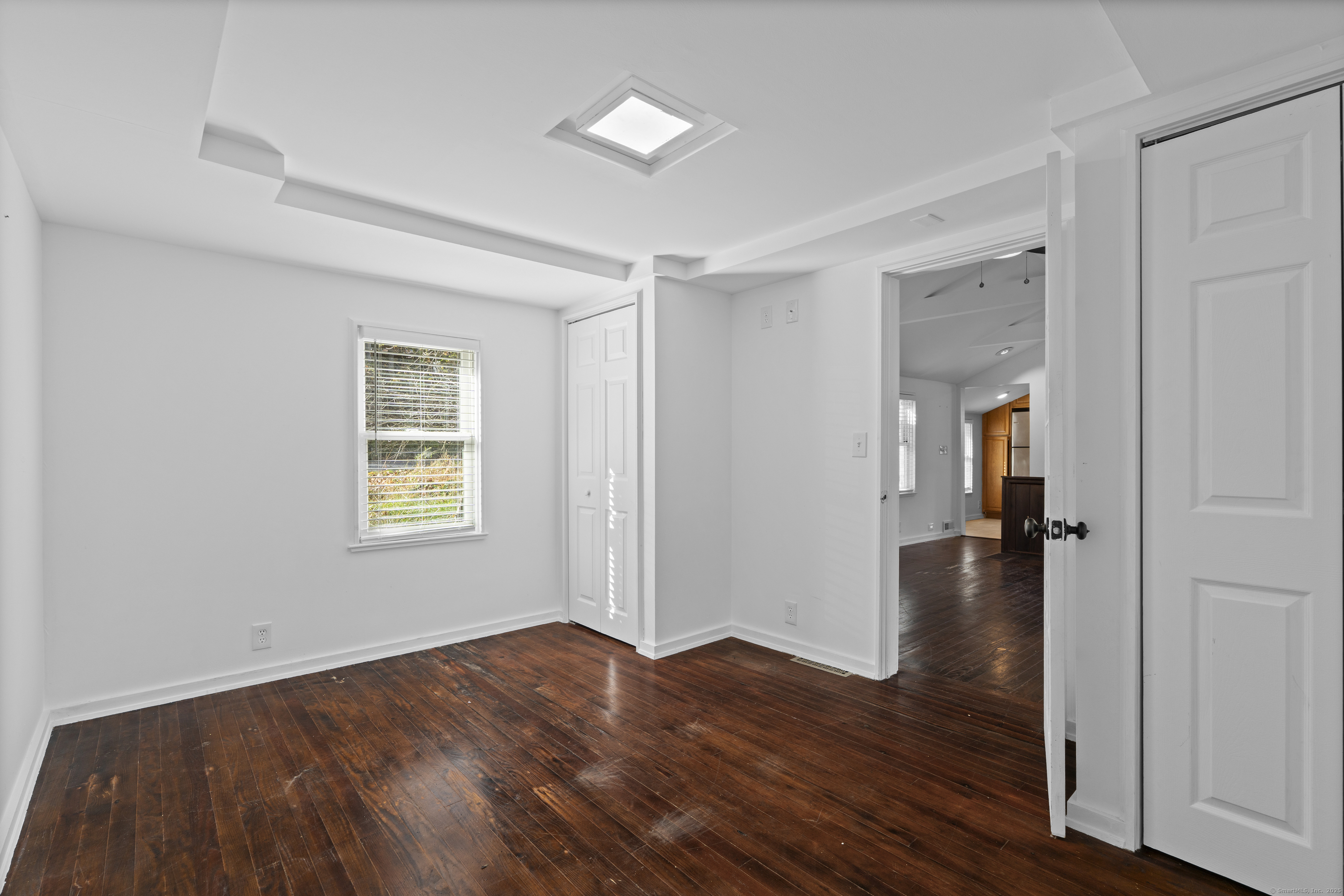 612 Kent Road New Milford, CT 06755 - Photo 13 of 35 an empty room with wooden floor and windows