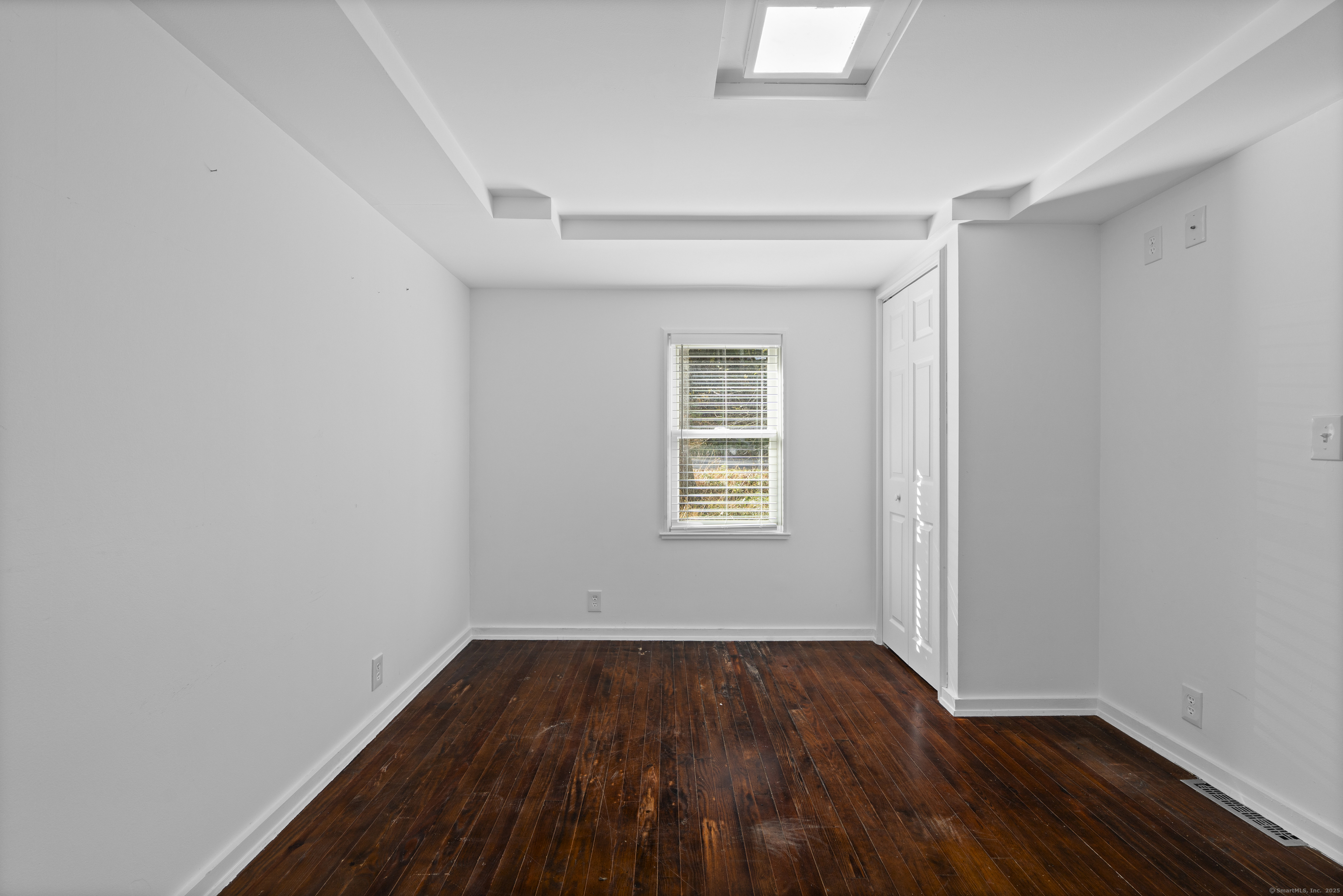 612 Kent Road New Milford, CT 06755 - Photo 14 of 35 an empty room with wooden floor and windows