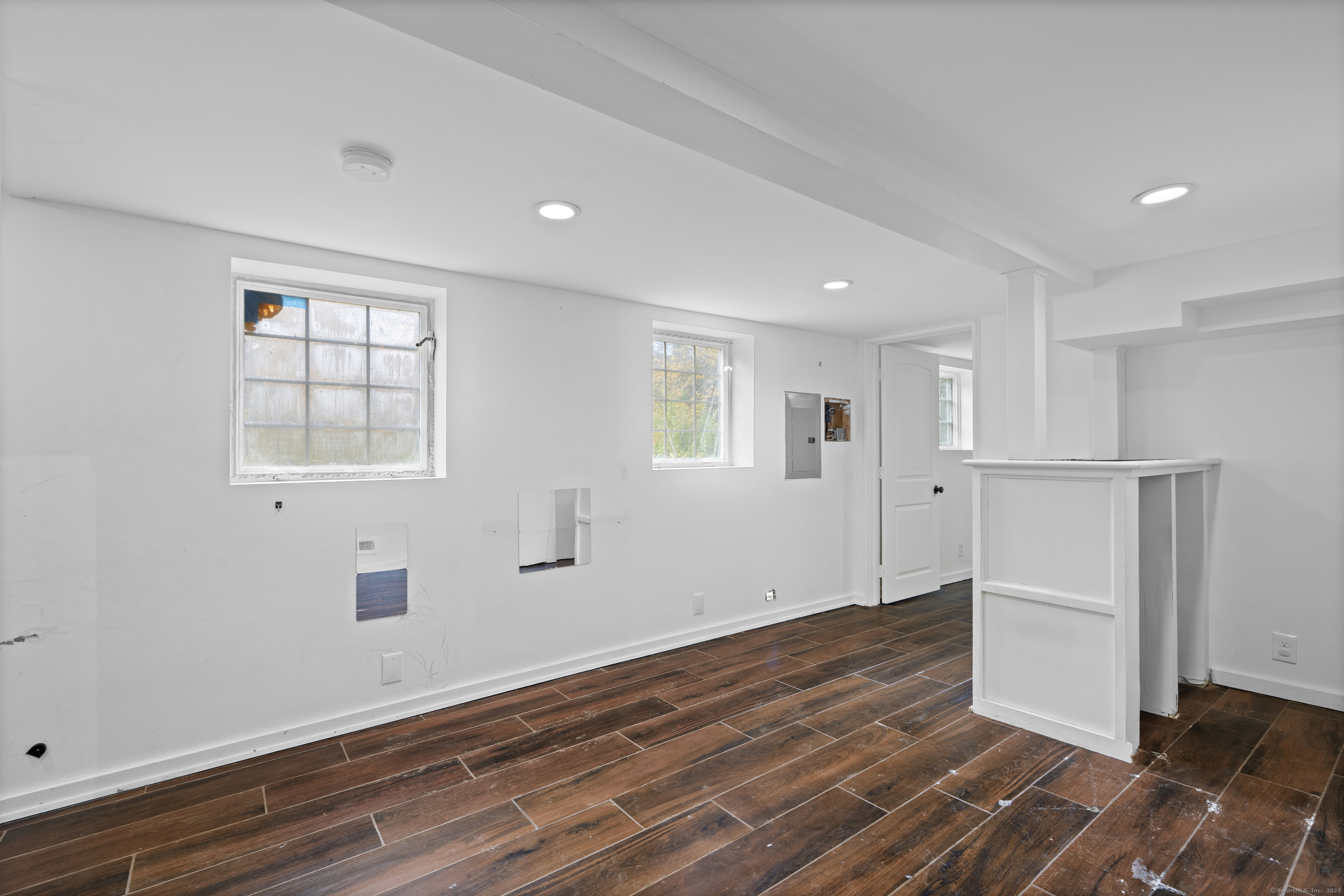 612 Kent Road New Milford, CT 06755 - Photo 25 of 35 an empty room with wooden floor and windows