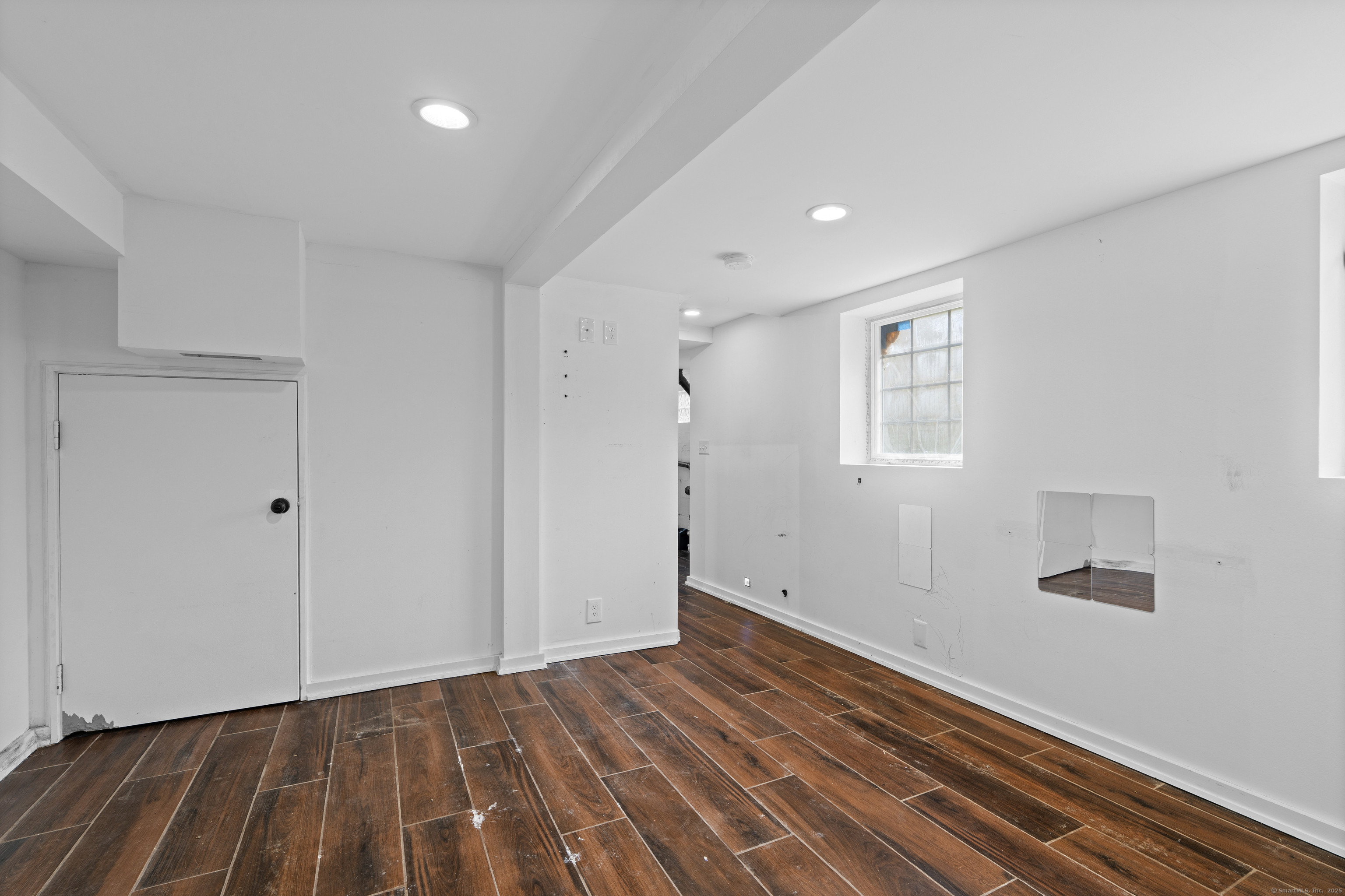 612 Kent Road New Milford, CT 06755 - Photo 27 of 35 a view of a room with wooden floor and white walls