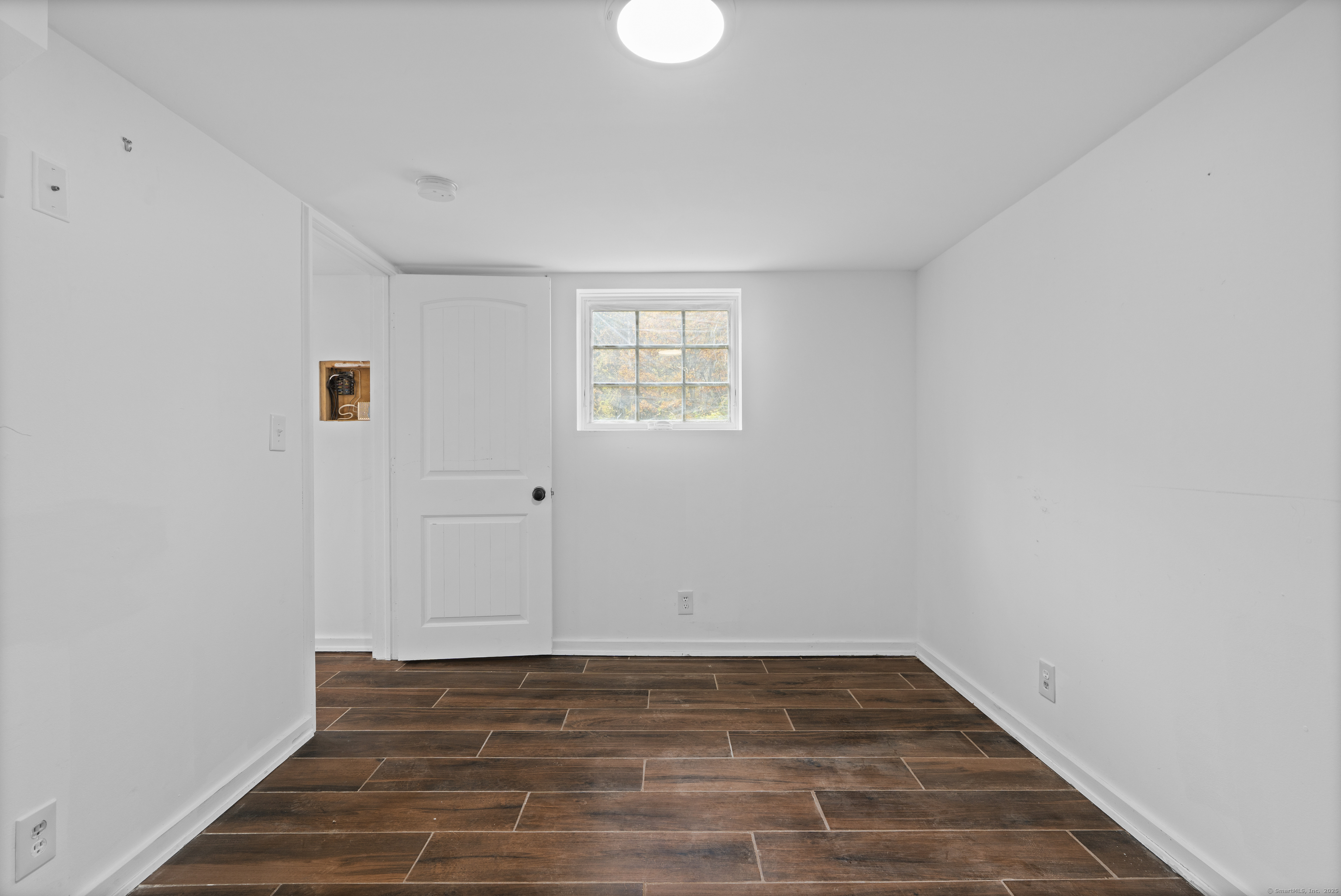 612 Kent Road New Milford, CT 06755 - Photo 32 of 35 a view of empty room with wooden floor