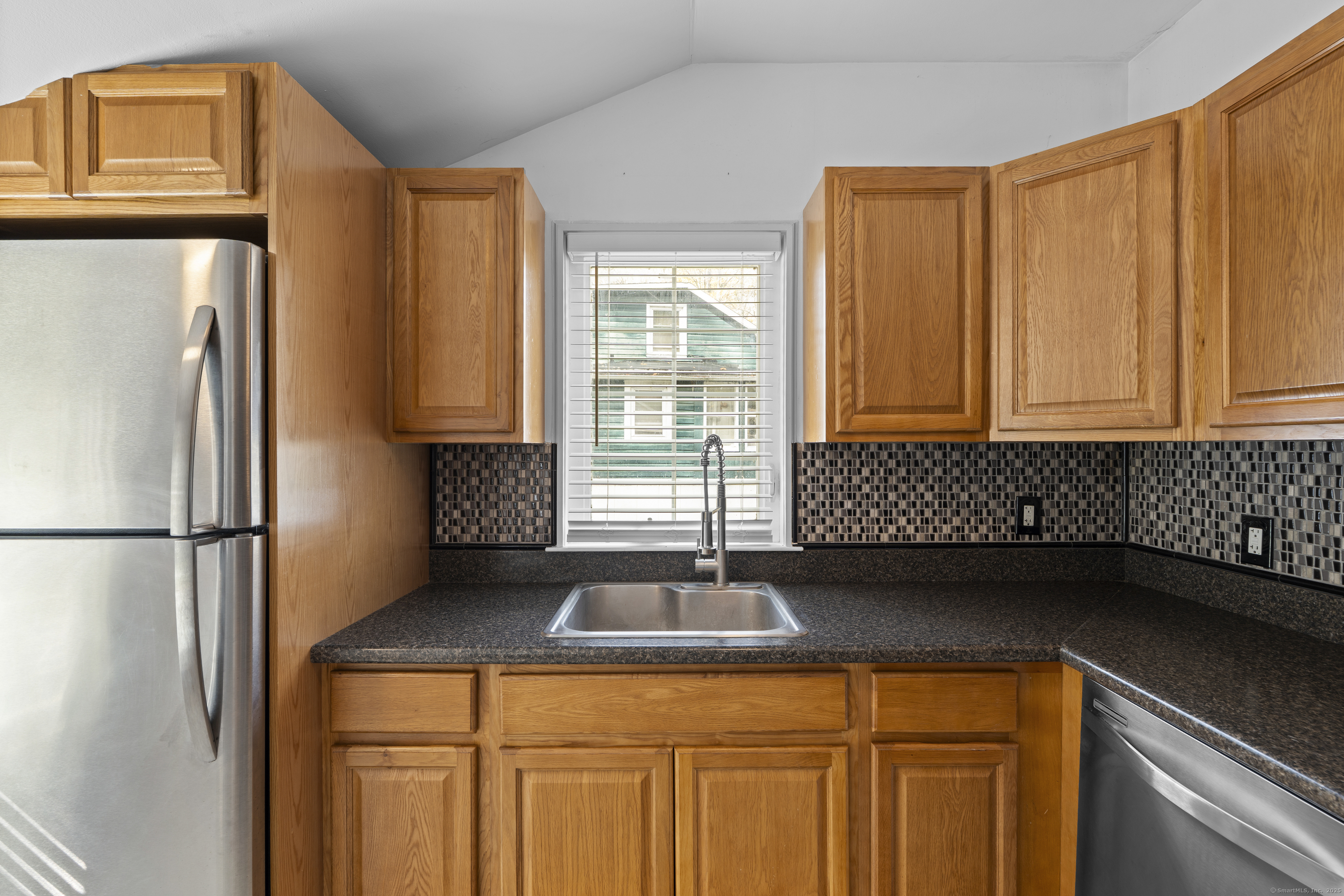 612 Kent Road New Milford, CT 06755 - Photo 4 of 35 a kitchen with a refrigerator and a sink