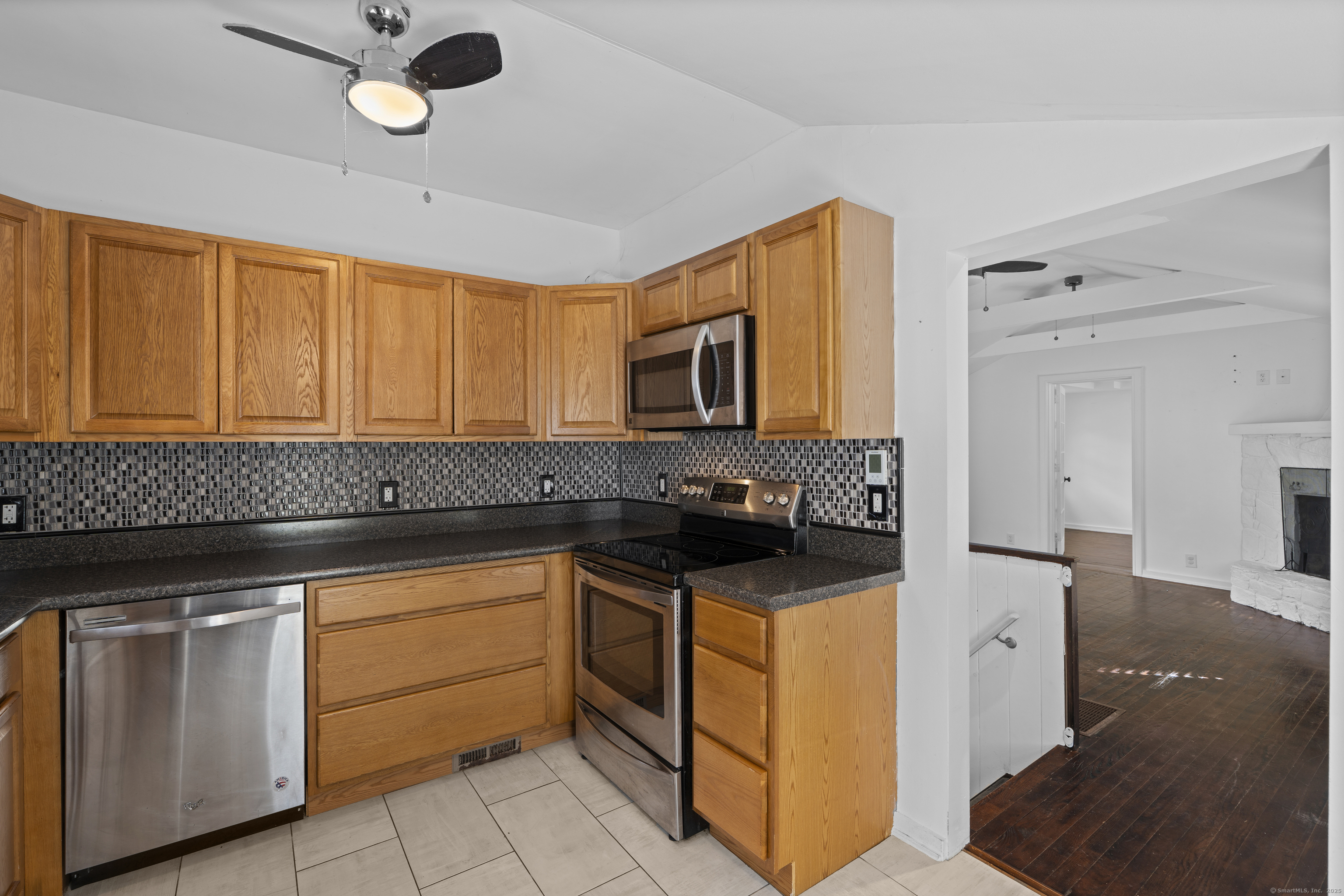 612 Kent Road New Milford, CT 06755 - Photo 5 of 35 a kitchen with granite countertop cabinets stainless steel appliances and a counter space