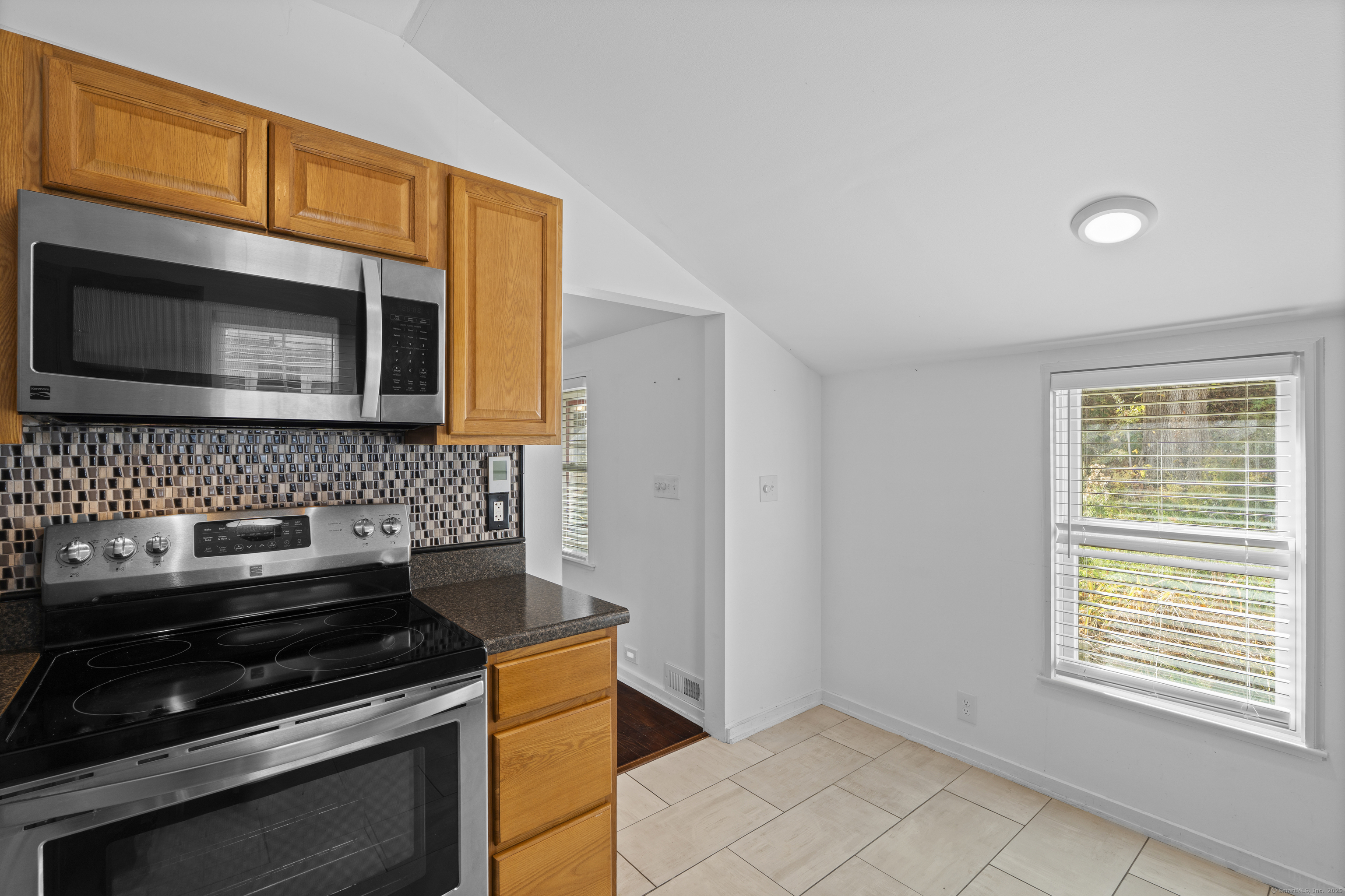 612 Kent Road New Milford, CT 06755 - Photo 6 of 35 a kitchen with granite countertop cabinets stainless steel appliances and a window