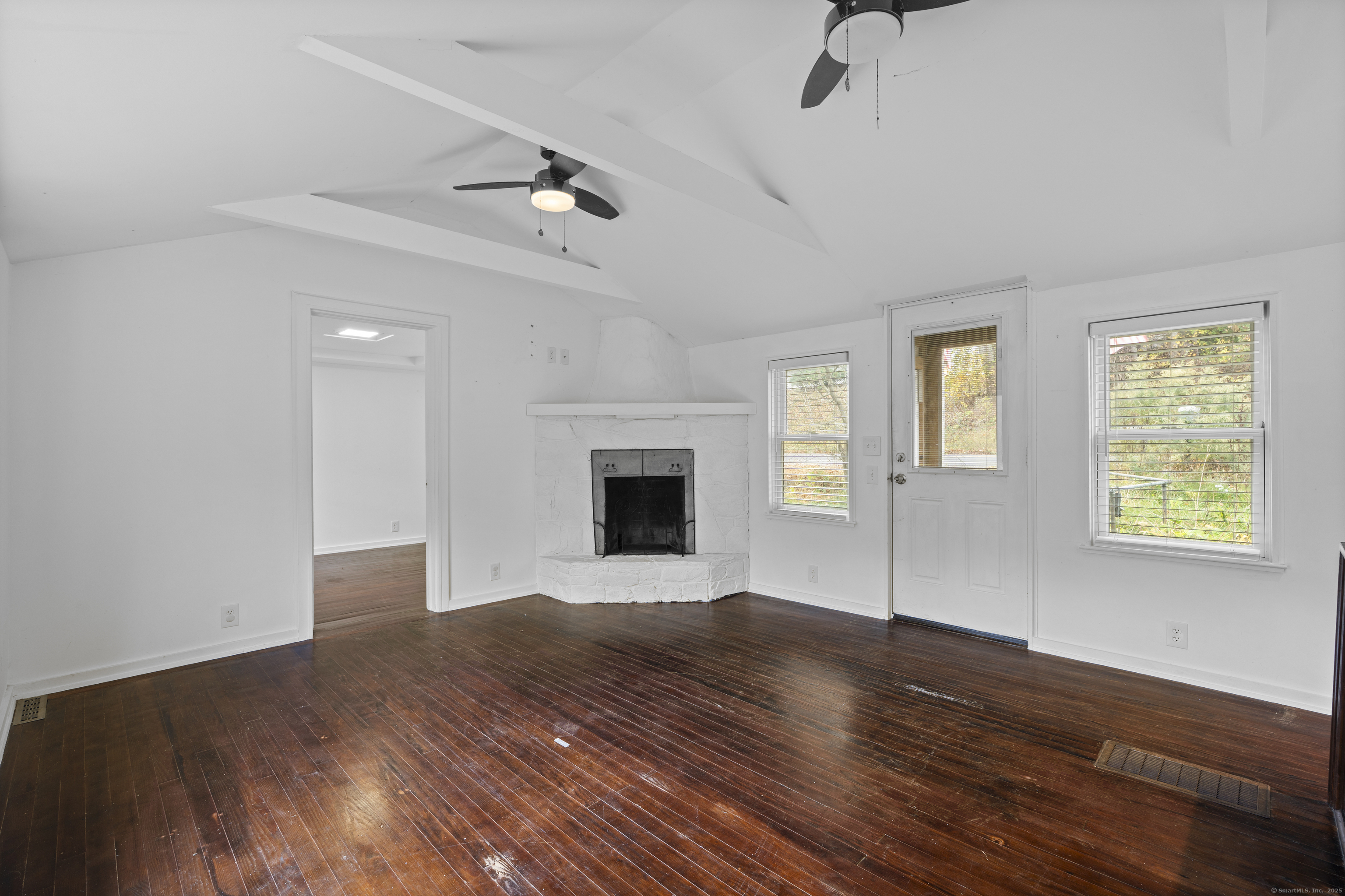 612 Kent Road New Milford, CT 06755 - Photo 7 of 35 a view of an empty room with glass door and wooden floor