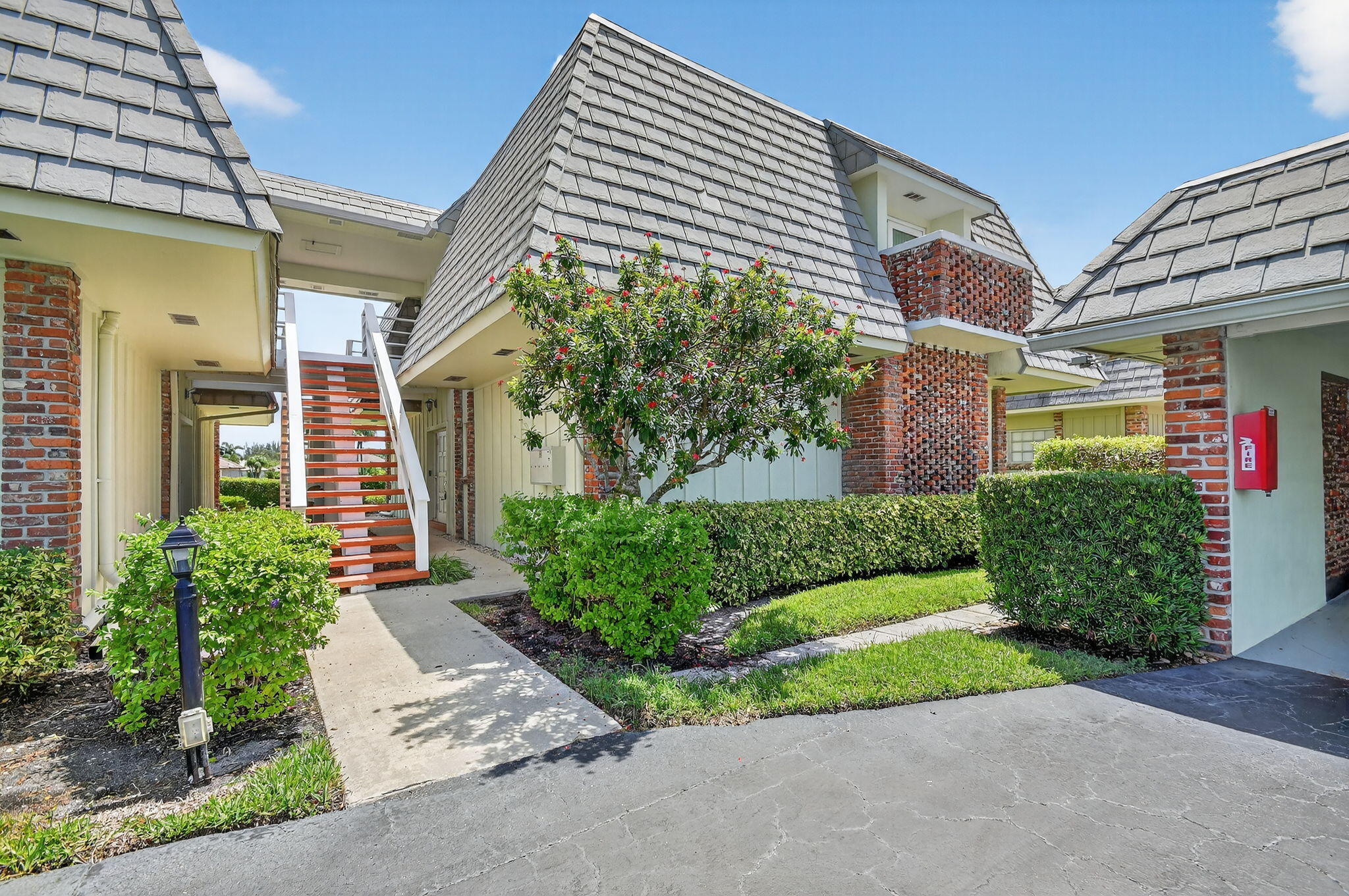 a front view of a house with garden