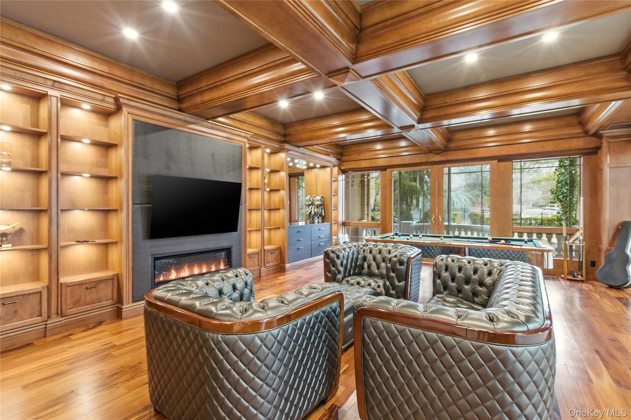 55 Coves Run Syosset, NY 11791 - Photo 20 of 50 a living room with furniture and a flat screen tv