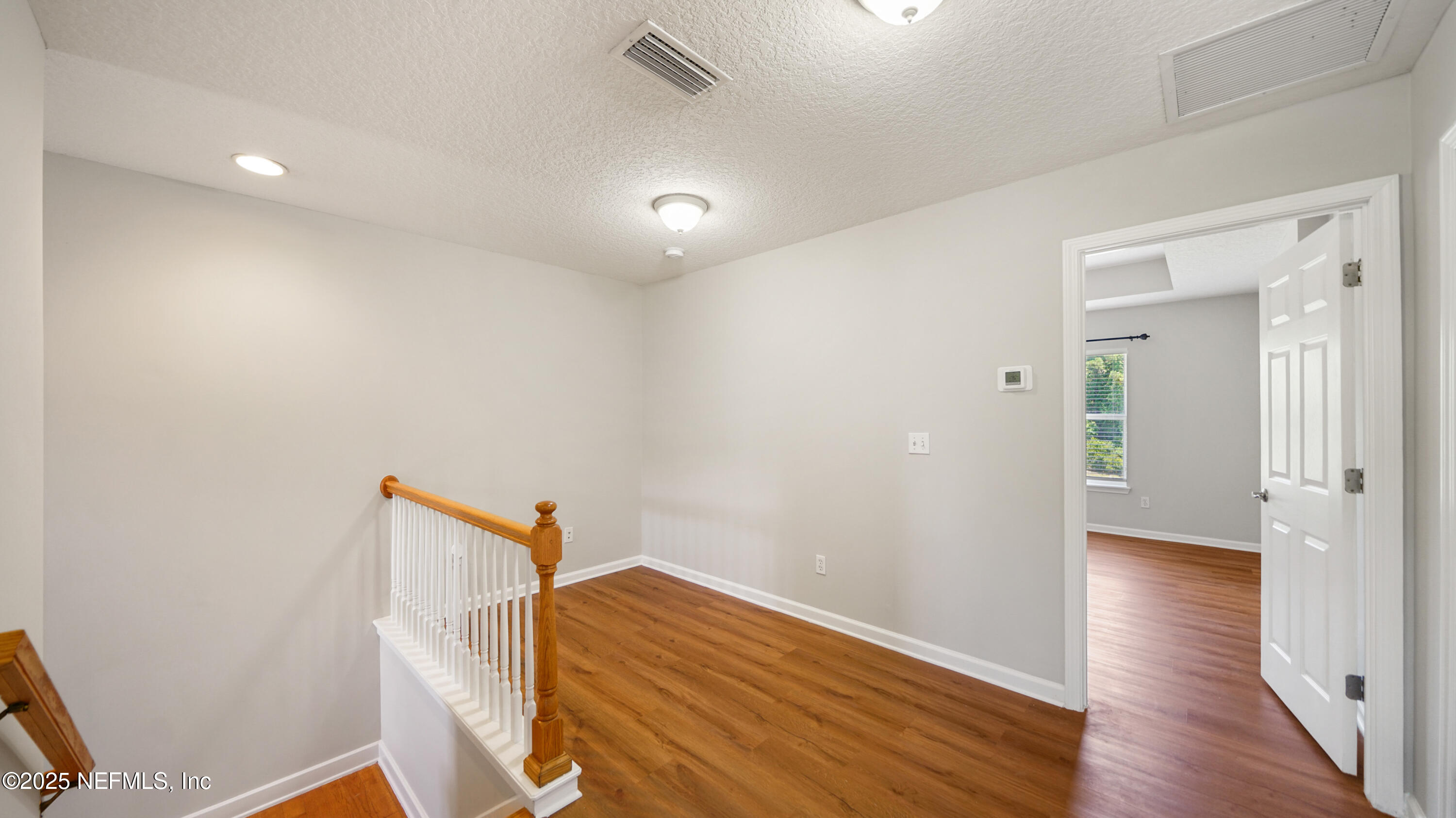 18 Amistad Drive St. Augustine, FL 32086 - Photo 12 of 36 a view of empty room with wooden floor